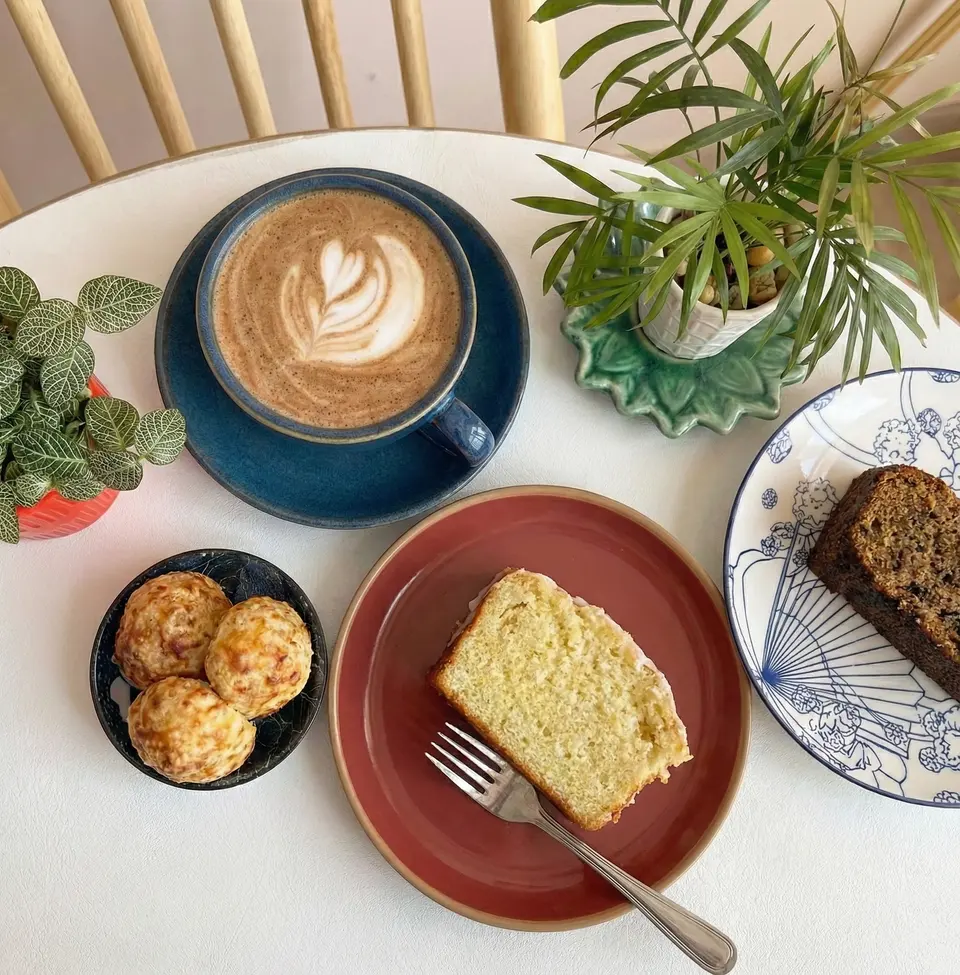 Close-up of coffee and pastries at the counter